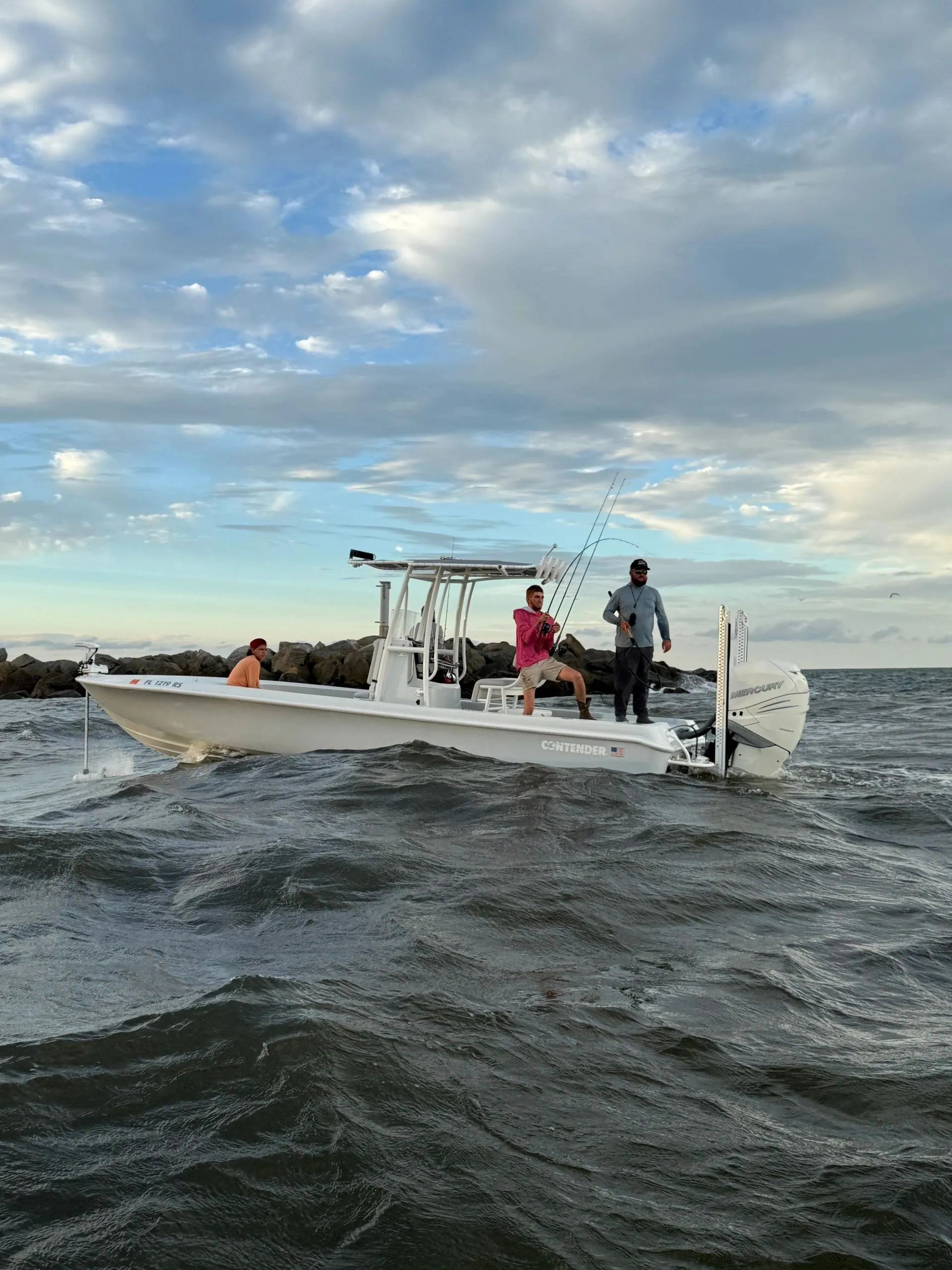 Captain Brenden Mora running the Contender bay boat through Ponce Inlet at sunrise