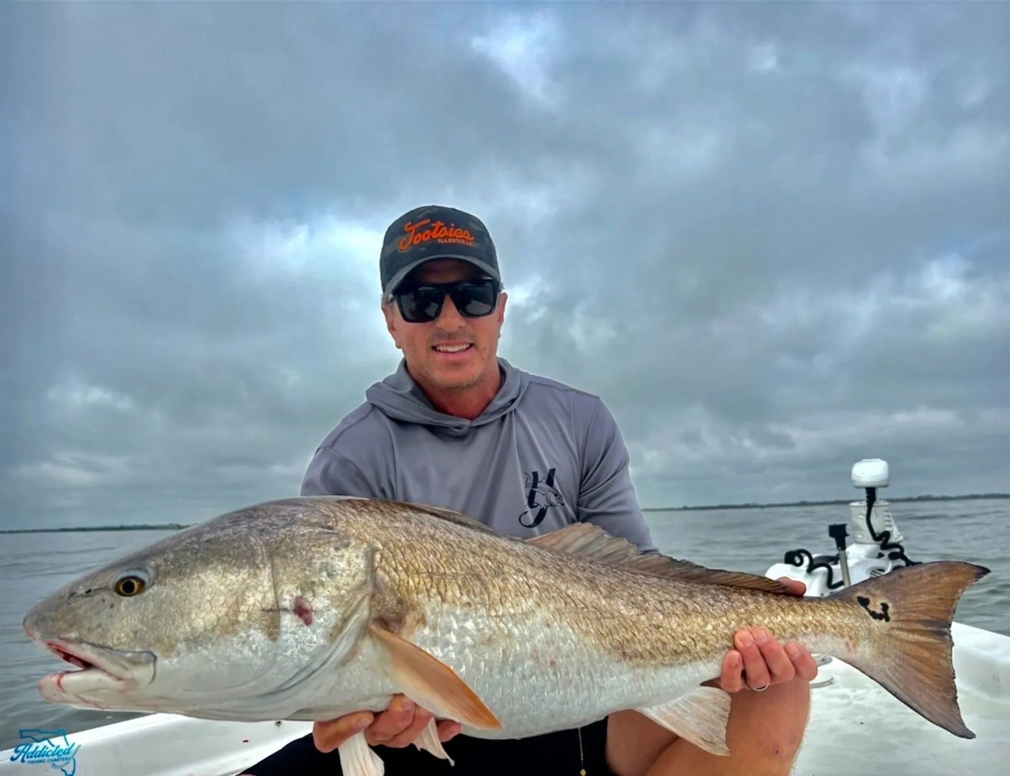 Group of four anglers with redfish catches from a New Smyrna Beach charter
