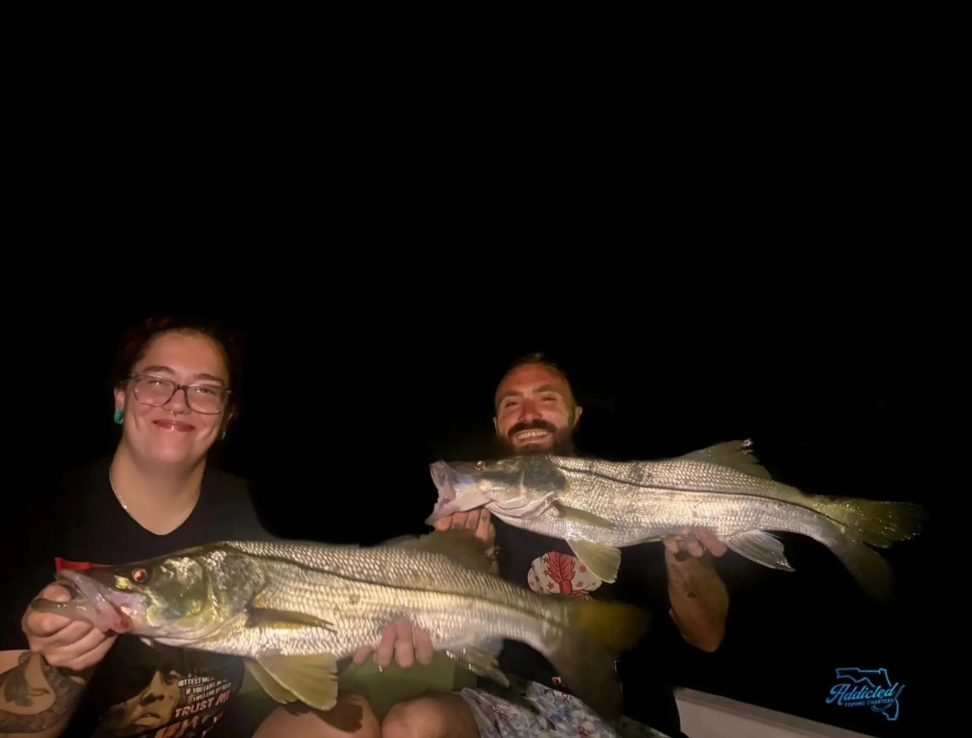 Night-caught redfish under bridge lights in Ponce Inlet