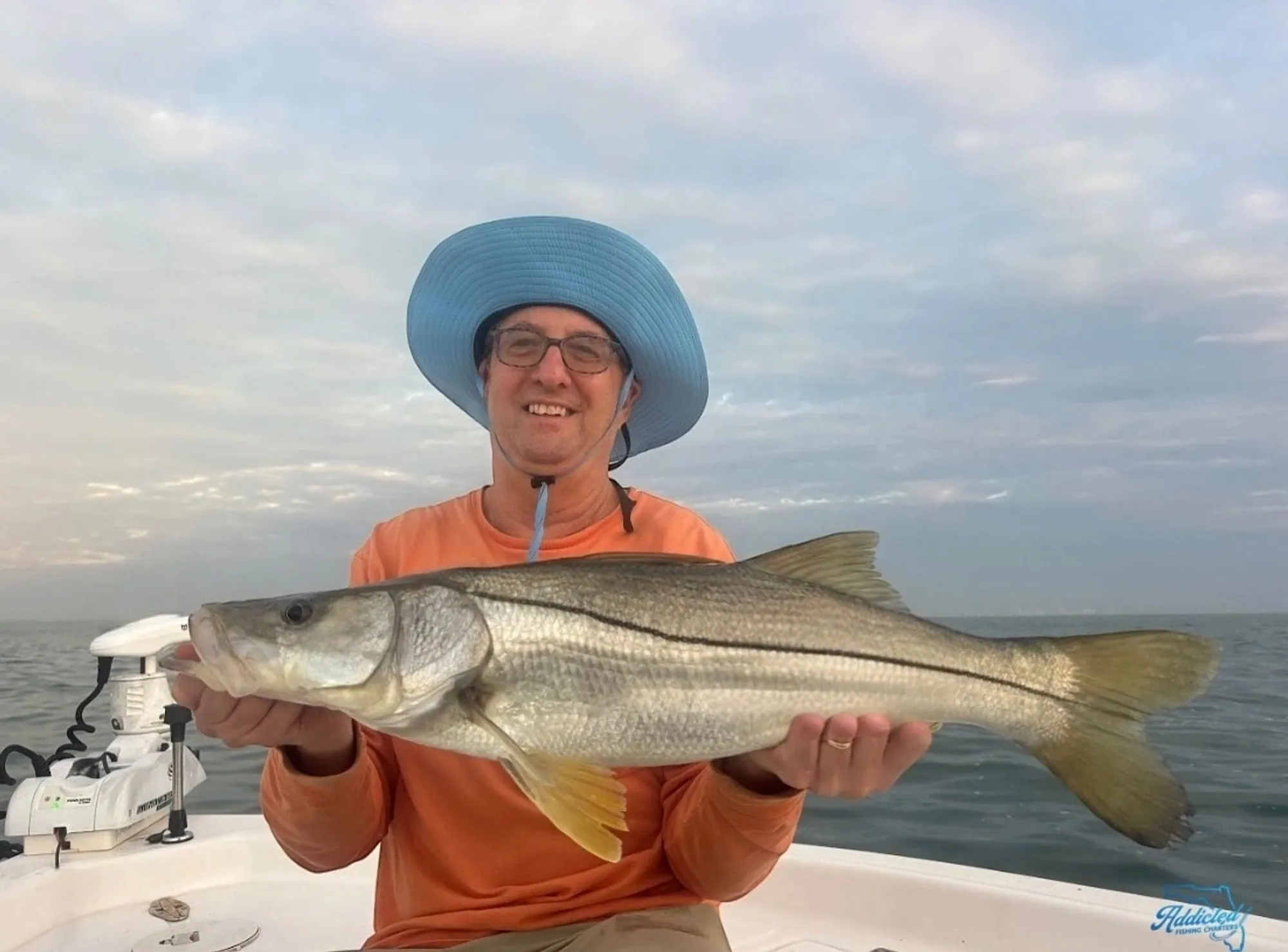 Father-son fishing trip with a hefty redfish catch