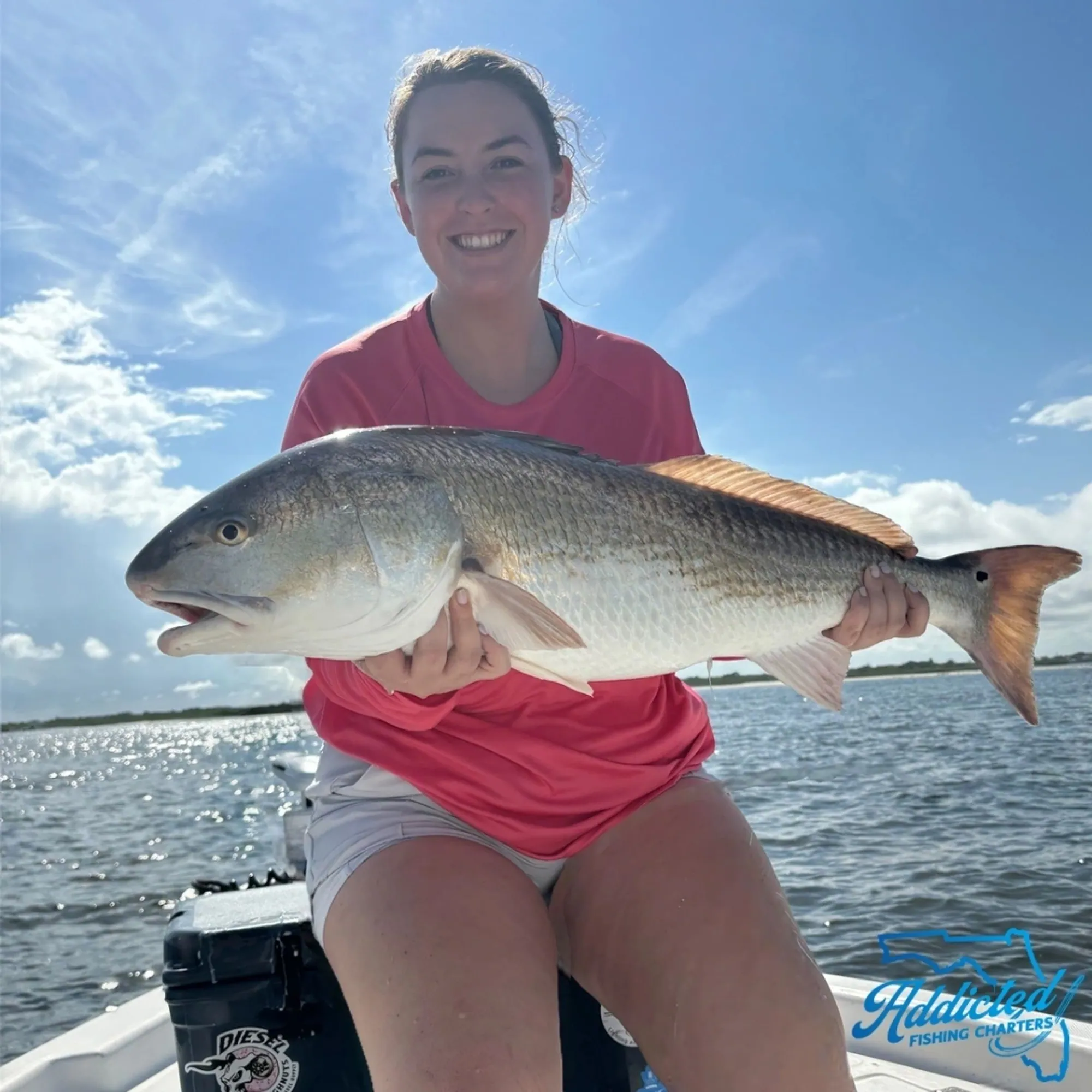 Angler casting to tailing redfish on a Mosquito Lagoon flat