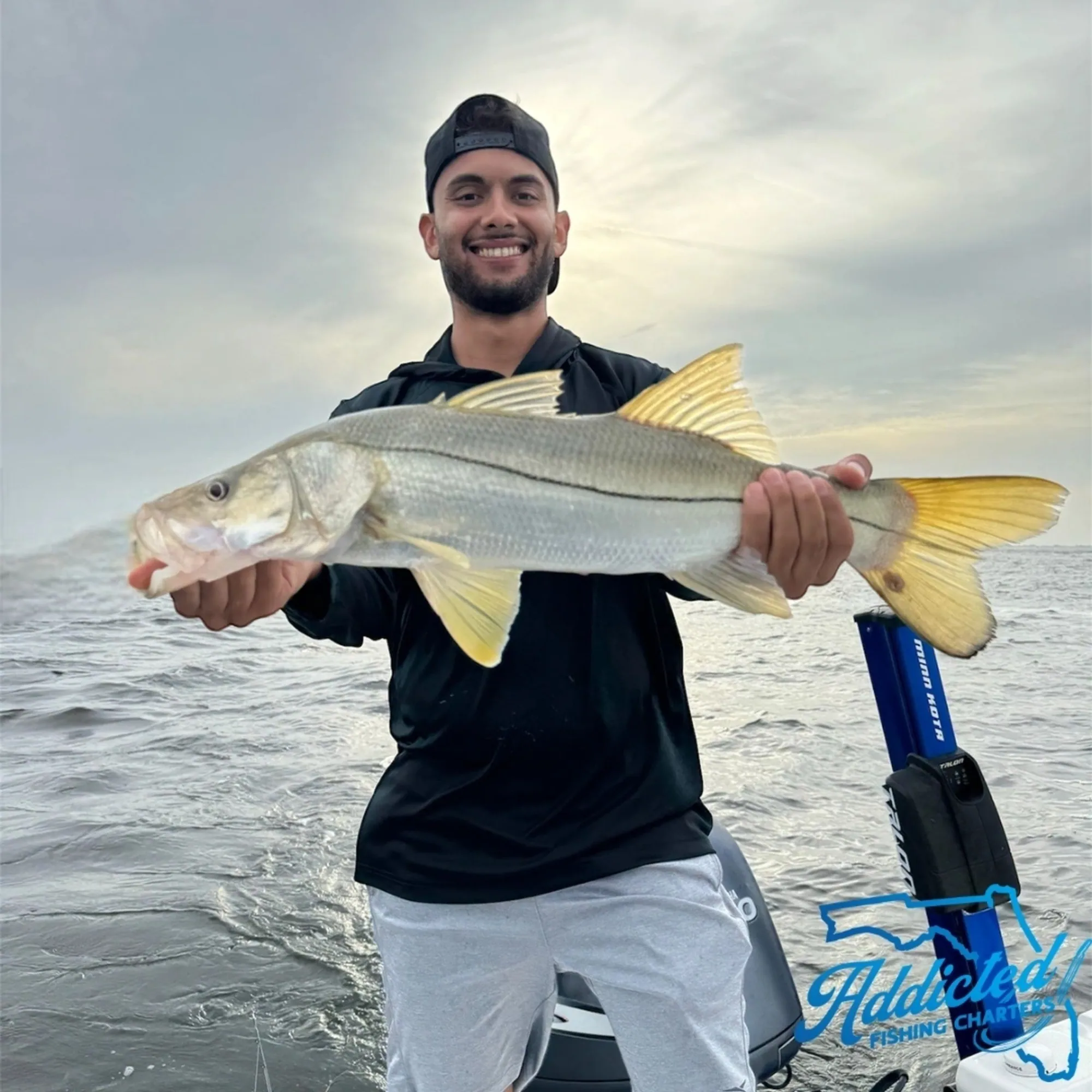 Captain Brenden fighting a fish on the Contender