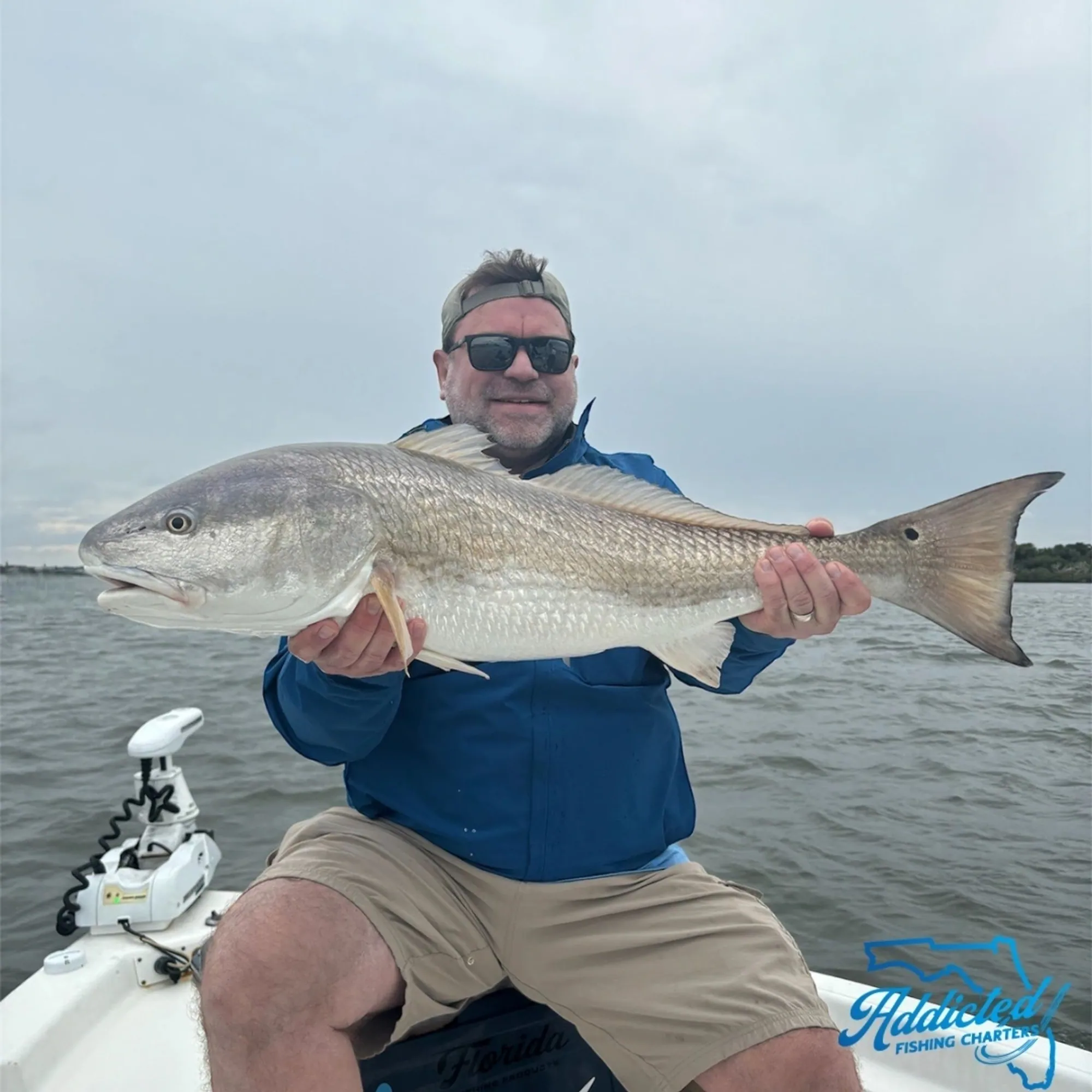 Angler with a bonnethead shark caught nearshore