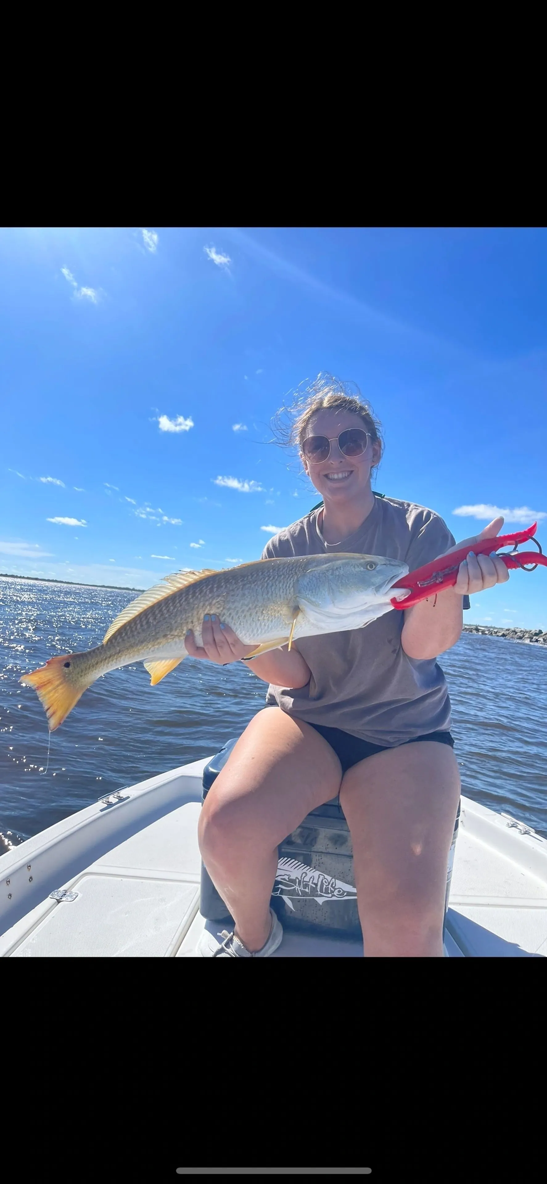 Family fishing trip memory — smiles and a big fish