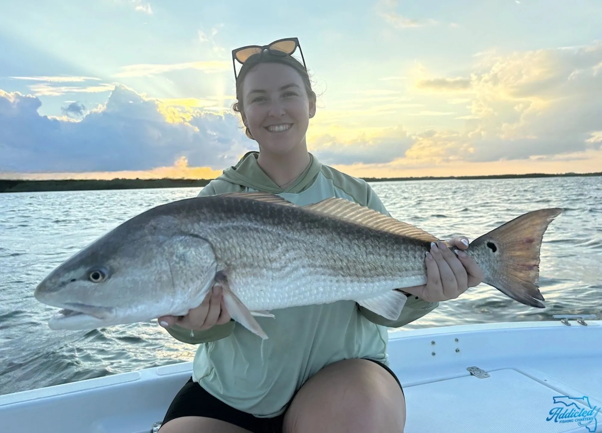 Customer catch photo — big smile, big redfish