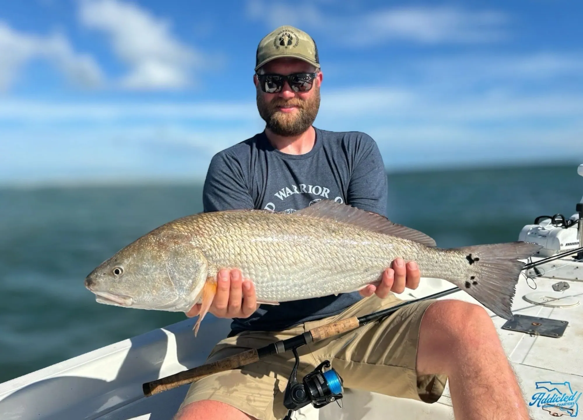 Wading angler ready to release a slot redfish